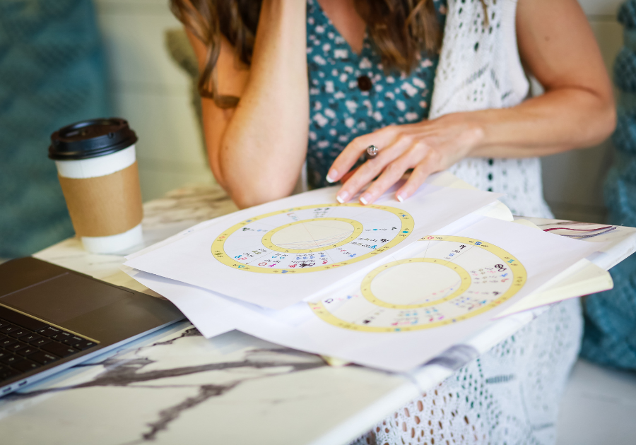 Claire Gallagher, astrologer, reading a chart.